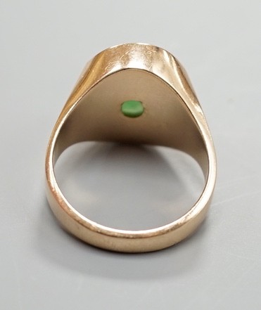 A 14k, cabochon jade and diamond chip set dress ring, size R/S, gross 7.6 grams.